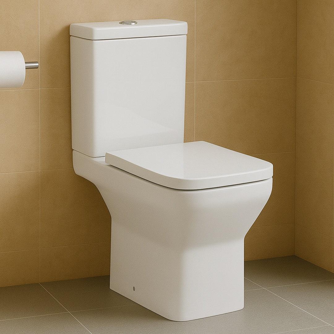 White toilet against a beige tiled wall