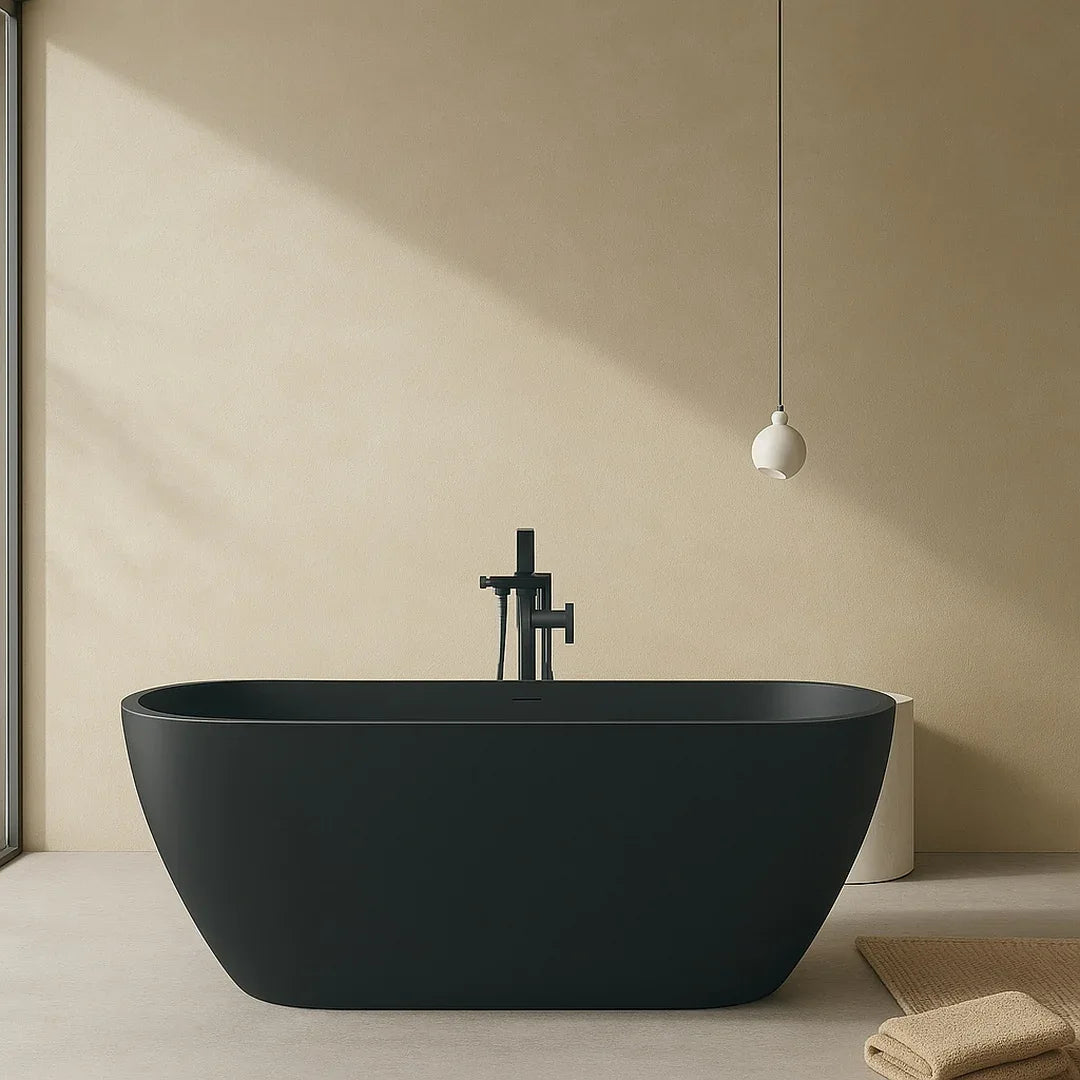 Modern black freestanding bathtub in a minimalistic bathroom with beige walls and floor.