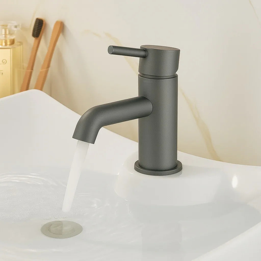Black faucet on a white sink with a neutral background