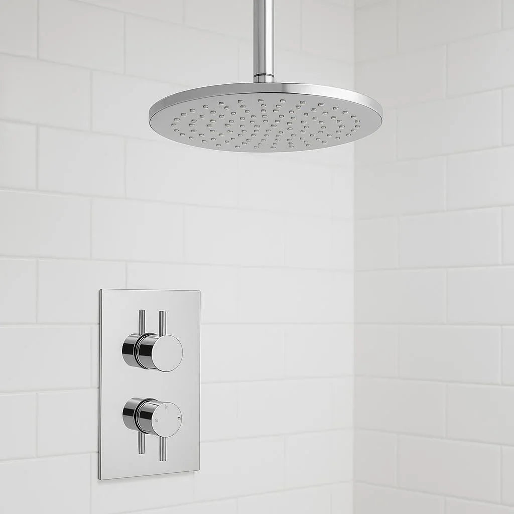 Chrome shower head and control panel on a tiled bathroom wall