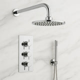 Chrome shower head and control panel on a marble wall