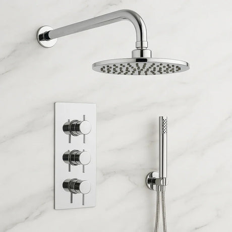 Chrome shower head and control panel on a marble wall