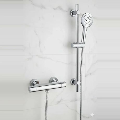 Chrome shower system with handheld shower head and control handle on a marble wall background