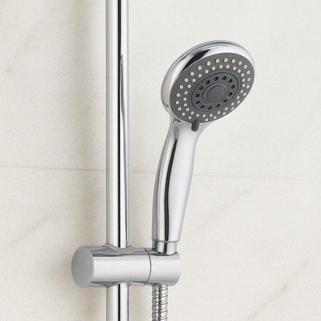 Chrome shower head and hose against a tiled bathroom wall