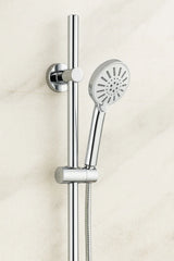 Chrome shower head and hose on a light beige background