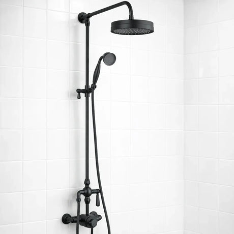 Black shower head and hose on a white tiled wall