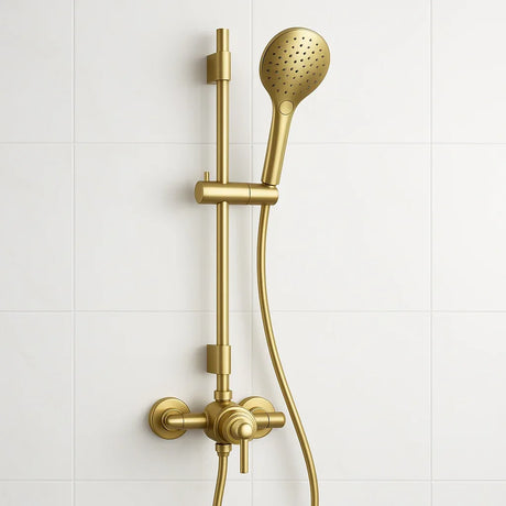 Gold shower head and control panel on a white tiled wall