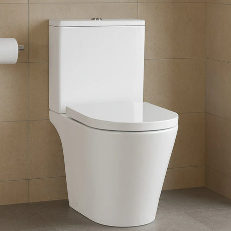 White toilet in a bathroom with beige tiles