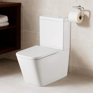 White toilet in a bathroom with beige tiles and a wooden shelf.