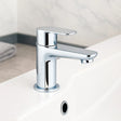 Chrome bathroom faucet on a white countertop with a neutral background