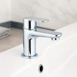 Chrome bathroom faucet on a white sink with a neutral background