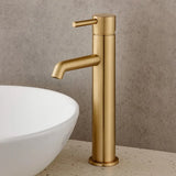 Gold faucet on a neutral background