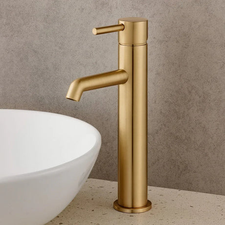 Gold faucet on a neutral background