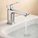Chrome faucet with water flowing into a sink against a beige background