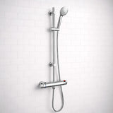 Chrome shower head and hose on a white tiled wall
