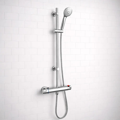 Chrome shower head and hose on a white tiled wall