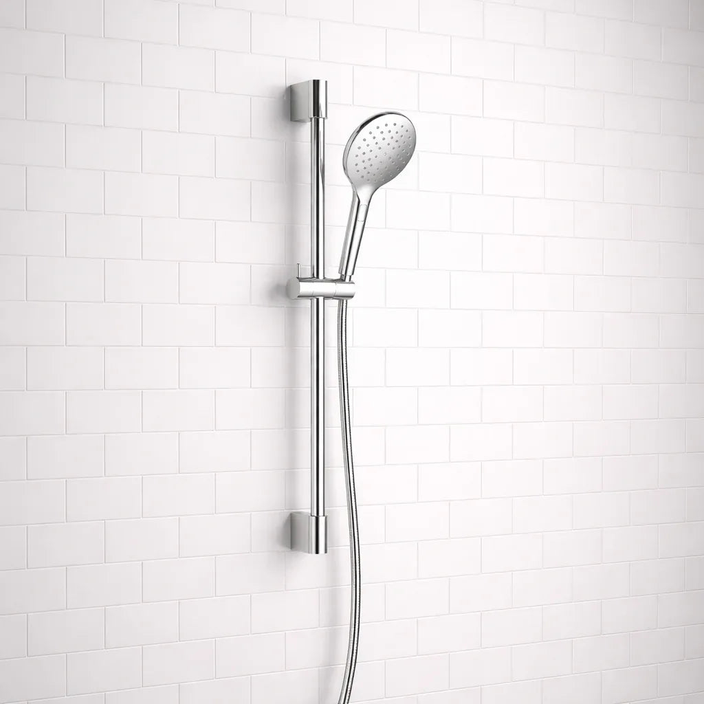Chrome shower head and hose against a white tiled wall