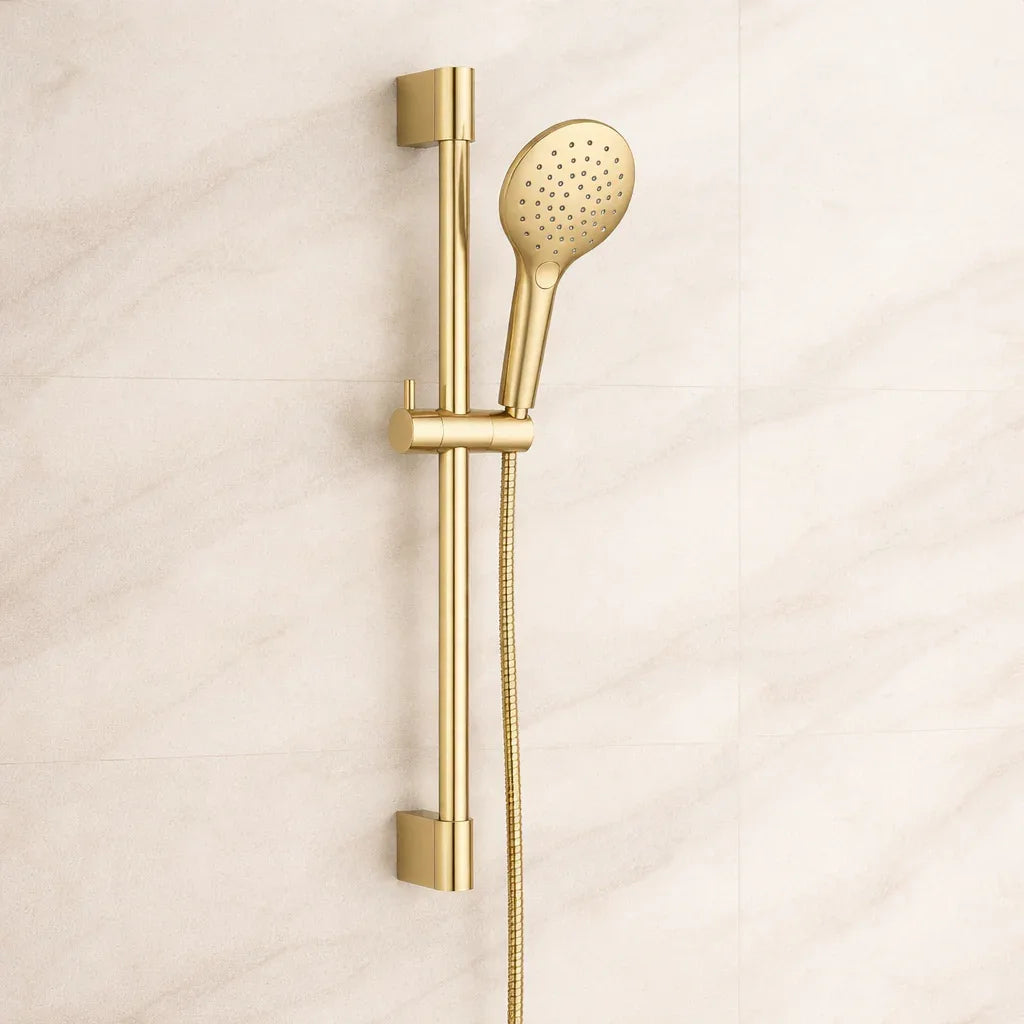 Gold shower head and handheld shower on a beige background
