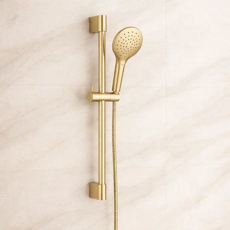 Gold shower head and handheld shower on a beige background