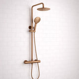 Bronze shower set with multiple nozzles on a white tiled wall background