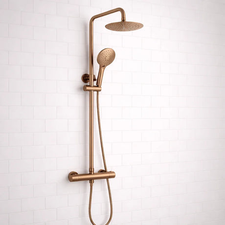 Bronze shower set with multiple nozzles on a white tiled wall background
