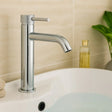 Chrome faucet on a sink with a neutral background