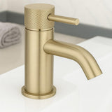 Gold faucet on a white background