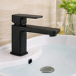 Black faucet on a white sink with a blurred background